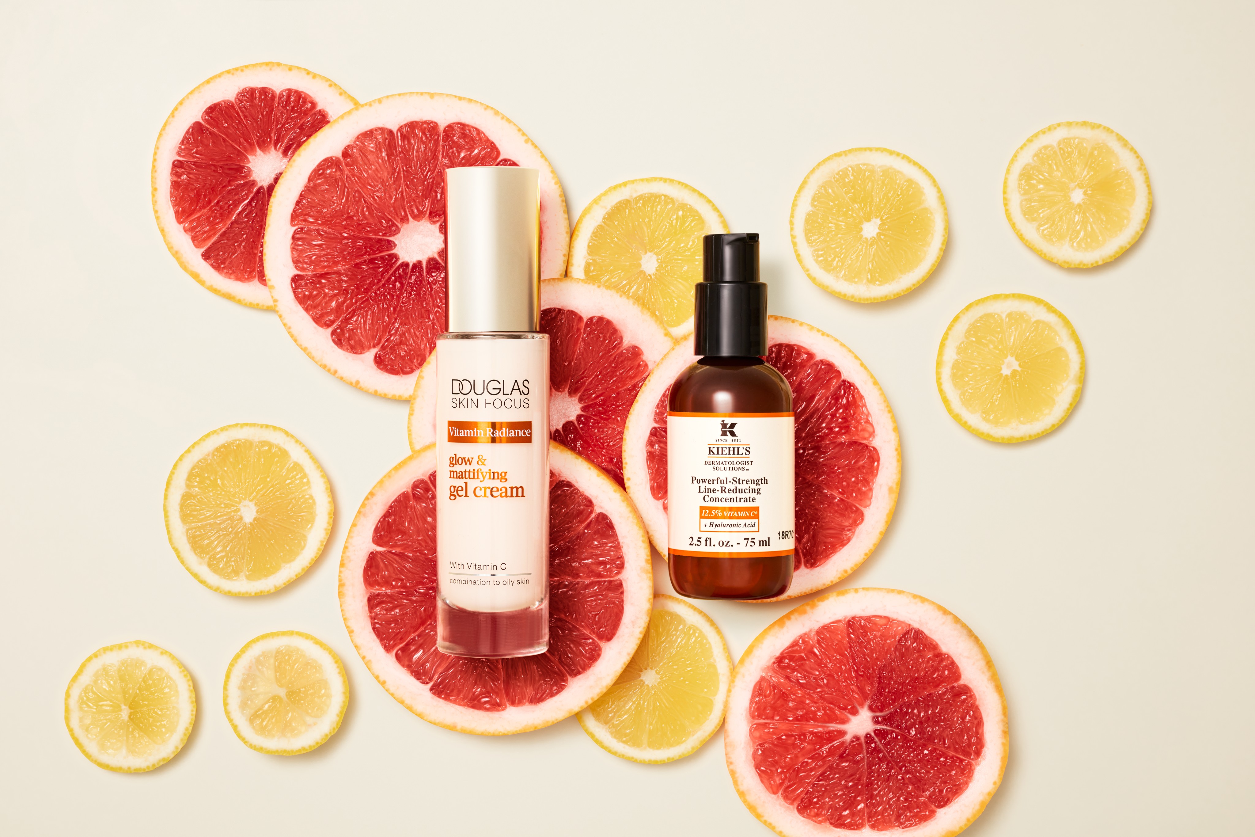 Skincare-product-beige-background-grapefruit-slices-douglas-collection-kiehls-vitamin-c-unlimited-Web-Rendition