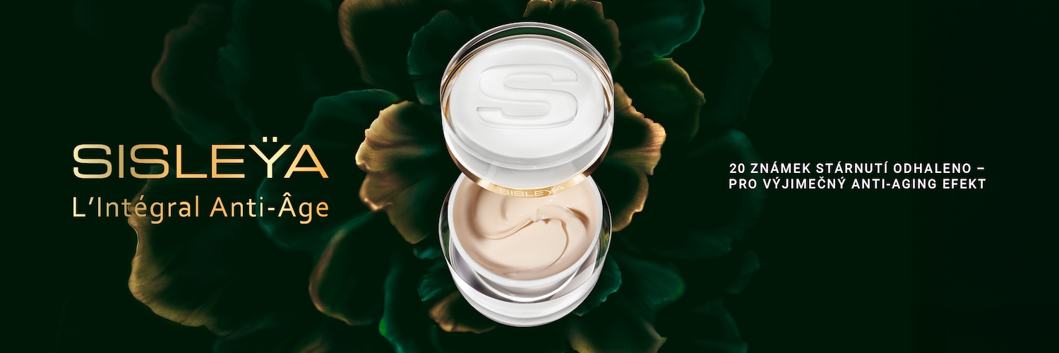 Pohled shora na otevřený krém Sisley L'Intégral Anti-Âge s bílým víčkem s vyrytým písmenem S a béžovým krémem, který slibuje odhalení 20 známek stárnutí pro výjimečný anti-aging efekt.