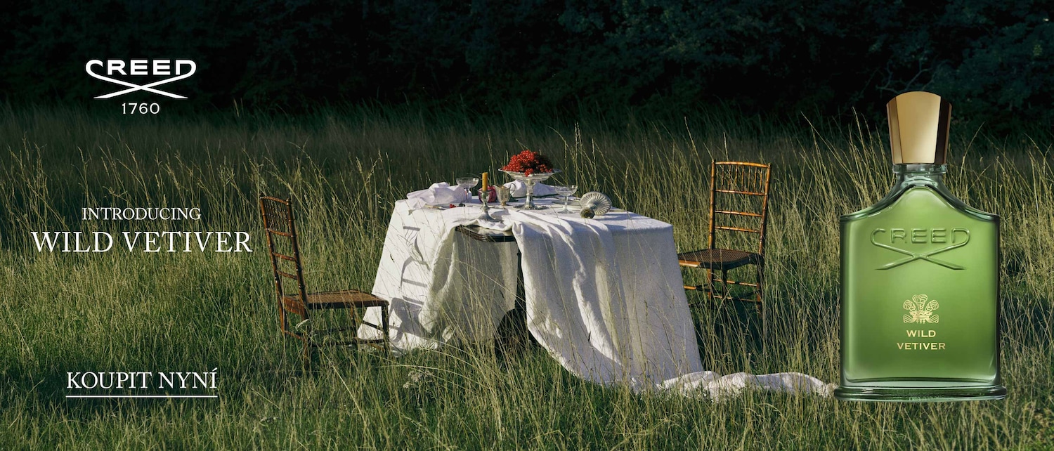 Představujeme Wild Vetiver od Creed, zelený flakon parfému s nápisem Wild Vetiver, umístěný v přírodním prostředí s prostřeným stolem. Kupte nyní.