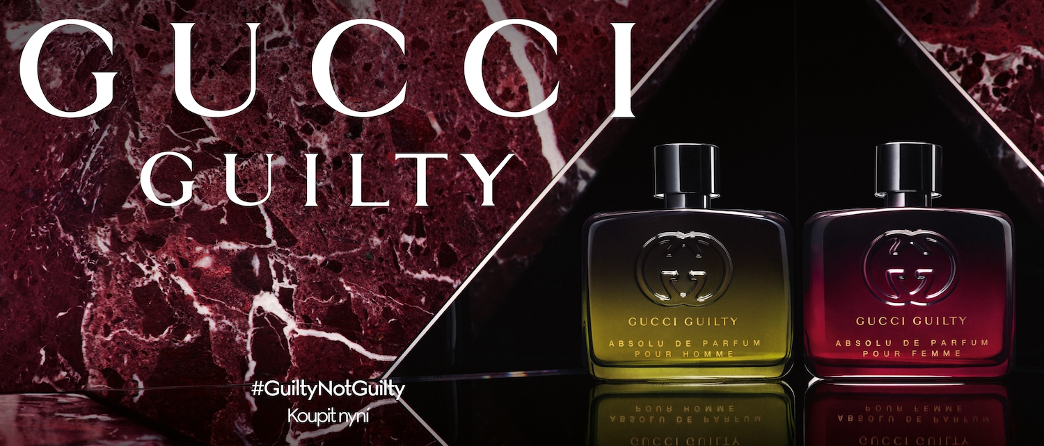 Dva flakony parfému Gucci Guilty Absolu, jeden pro muže se žlutavým nádechem a druhý pro ženy s červeným nádechem, oba s logem Gucci a nápisem #GuiltyNotGuilty.